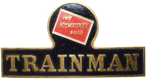 the MILWAUKEE ROAD TRAINMAN BADGE